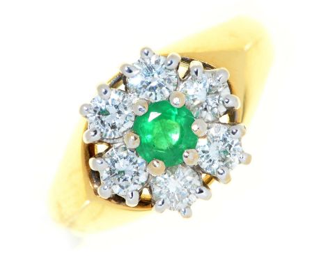 An emerald and diamond cluster ring, in 18ct gold, London 1980, 5.3g, size I Condition ReportGood condition