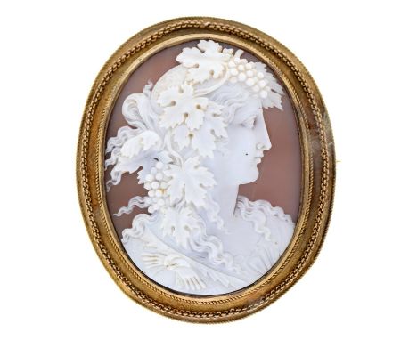 A cameo brooch, 19th c, the oval shell finely carved with the head of a bacchante, in silver gilt mount, 56mm Condition Repor