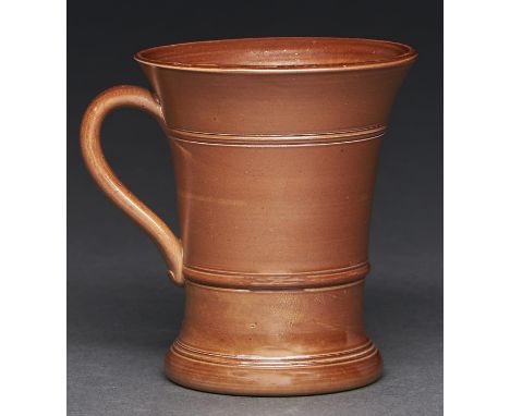 A Derbyshire saltglazed brown stoneware mug, Chesterfield, late 19th c, finely potted and of flared shape in early 18th c sty