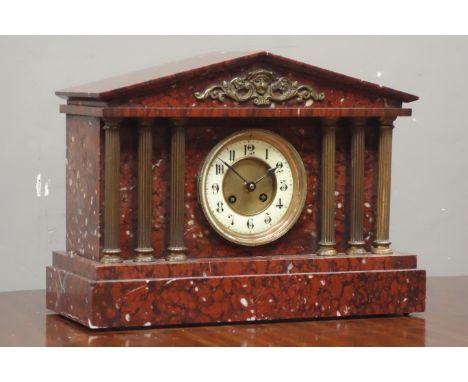 Late 19th century French rouge marble mantle clock, architectural cased with gilt metal columns, twin train movement striking