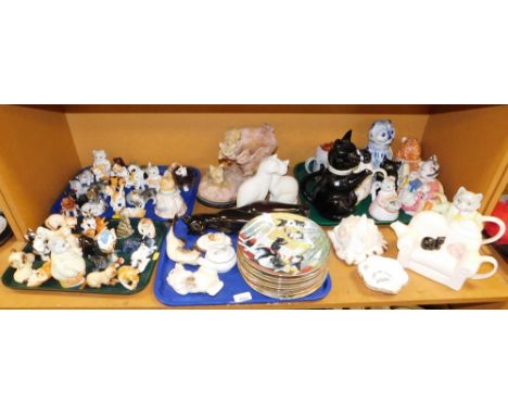 A large quantity of cat figures, cat collectors plates, novelty teapots, shell, etc. (1 shelf) 