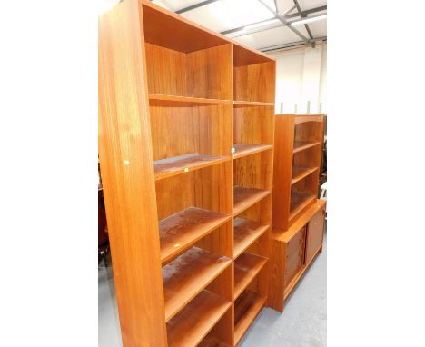 A teak sideboard, with four drawers to one side and a sliding compartment, 63cm high, 115cm wide, 39cm deep, a three shelf op