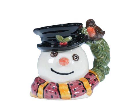 Marked as a "Design Original Sample" on the underside. The jug features a snowman wearing a black top hat adorned with holly 