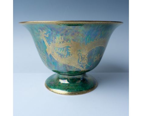 An exquisite Wedgwood lustre bowl, featuring a stunning green iridescent glaze with an intricate gold dragon motif encircling