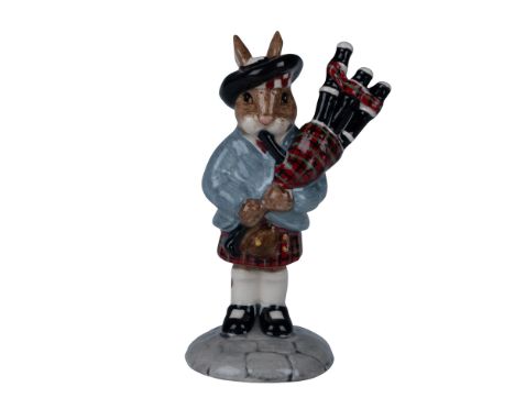 A rare and exclusive edition of the Royal Doulton Bunnykins figurine, featuring a unique and vibrant colorway in tartan plaid