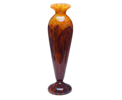 A striking Art Deco glass vase signed "Schneider," featuring a tall, flared form with a vibrant mottled red and orange design
