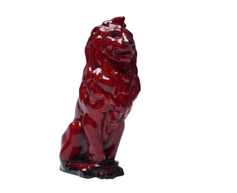 Finished in the iconic flambe glaze. This model features a stylized lion in a seated pose with detailed mane and body contour