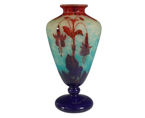 A stunning Le Verre Francais cameo glass vase featuring a vibrant color gradient from deep red to a speckled turquoise-blue b