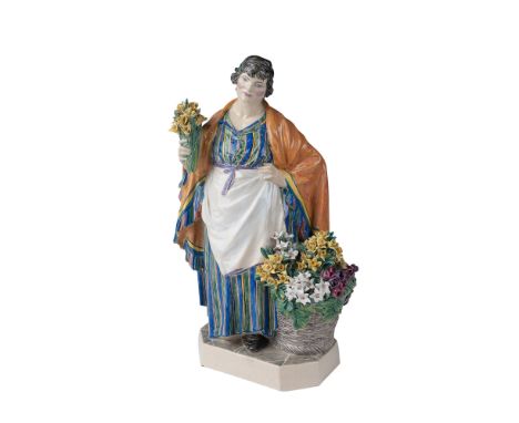 A finely crafted ceramic figurine by renowned British sculptor Charles Vyse, depicting the iconic The Daffodil Woman. This ex
