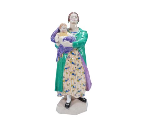 The figure portrays a woman holding a child, finished in polychrome glazes including a green coat, multicolored dress, and pu
