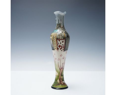 This slender ewer showcases a detailed scene of New York City's Central Park, featuring blooming magnolia flowers in the fore
