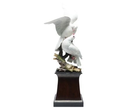 Royal Worcester bone china figurine depicting two white doves perched on a naturalistic branch. Designed by Ronald Van Ruycke