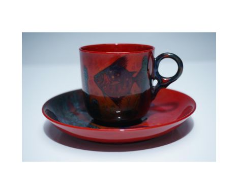 This exceptional Royal Doulton Flambe Sung cup and saucer set showcases the renowned artistry of Royal Doulton with its rich 