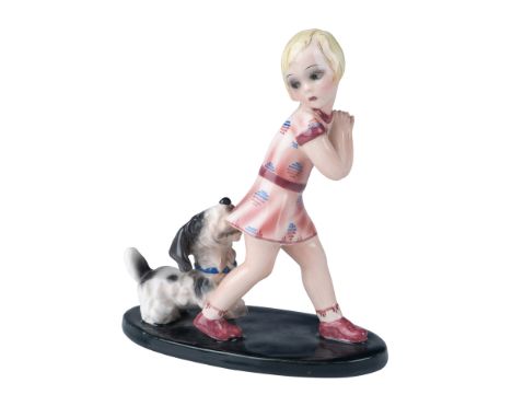 A delightful Goldscheider ceramic figurine featuring a young girl in a pink dress playfully interacting with her small dog. T