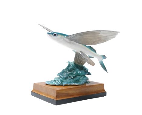 Royal Worcester bone china figurine titled Flying Fish, modelled by Ronald Van Ruyckevelt. This naturalistic depiction featur