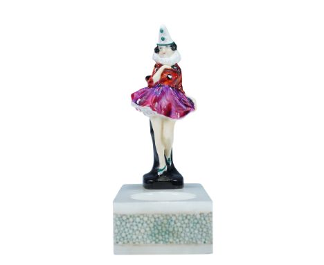 Royal Doulton porcelain mini figurine of Pierrette, Second Version, mounted on an onyx tray. The figure is dressed in a red, 
