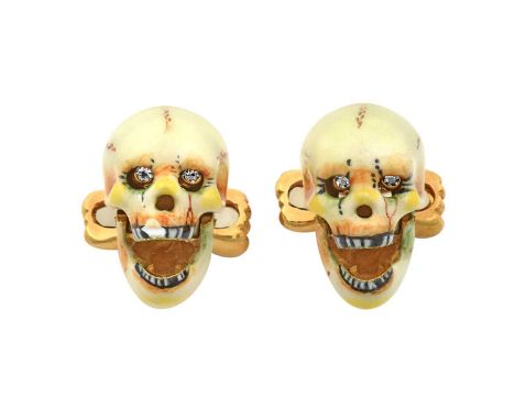 A Pair of 18 Carat Gold Enamel and Diamond Skull Cufflinksthe skull motif enamelled in cream, yellow, brown and green tones, 