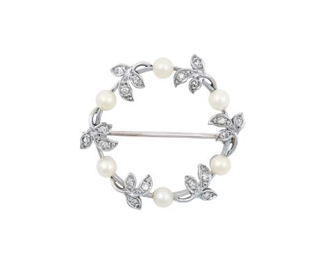 A Cultured Pearl and Diamond Broochthe circular frame comprised of cultured pearls alternating with eight-cut diamond set lea