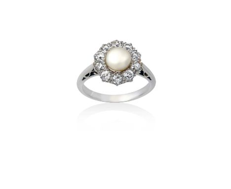 A Pearl and Diamond Cluster Ringthe pearl within a border of old cut diamonds, in white claw settings, to a tapered shoulder 