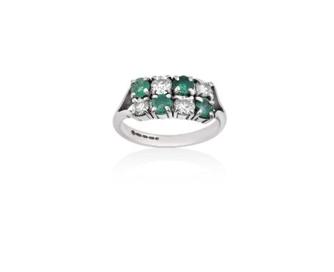 An 18 Carat White Gold Emerald and Diamond Two Row Ringthe round cut emeralds alternate with round brilliant cut diamonds, in