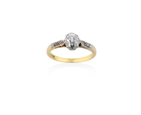 A Diamond Solitaire Ringthe oval old cut diamond in a white claw setting, to rose cut diamond set shoulders, on a yellow plai