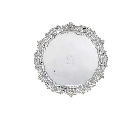 A George II Irish Silver Waiter,  Maker's Mark Rubbed, Dublin, Circa 1750  shaped circular and on three scroll feet, with fol