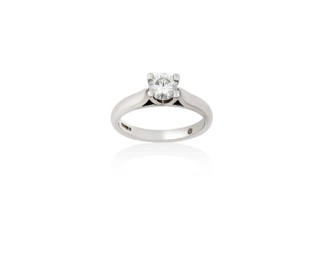 A Platinum Diamond Solitaire Ringthe round brilliant cut diamond in a four claw setting, to a tapered shoulder plain polished