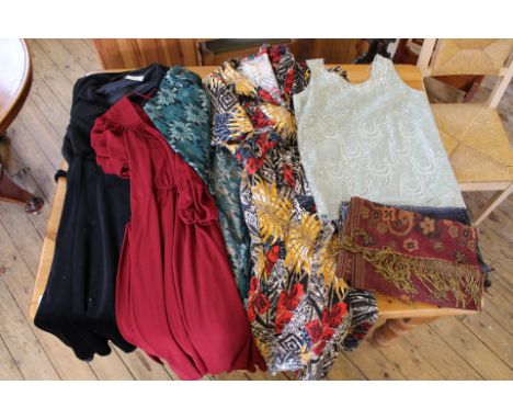 A collection of vintage clothing including dresses