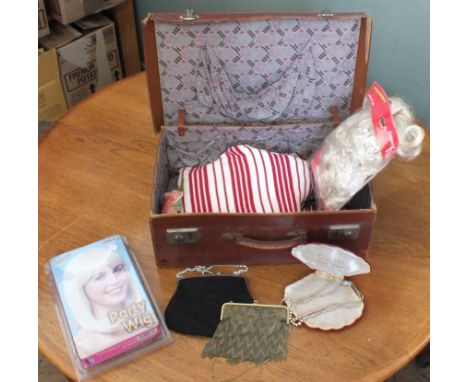A vintage suitcase and contents including wigs, a mesh handbag, a simulate pearl necklace etc
