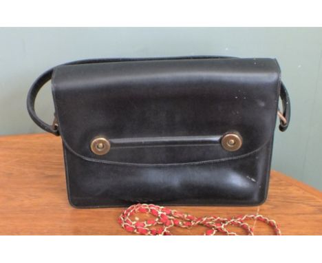 A vintage black leather Hermes handbag