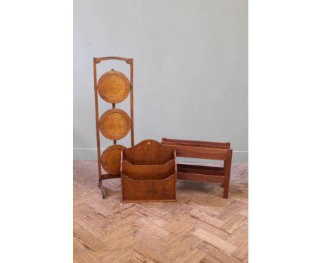 A folding oak cake stand and two magazine racks