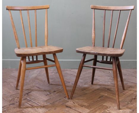 Two blonder Ercol stick back chairs