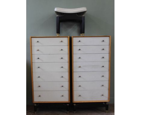 Two E. Gomme for G Plan teak and pale green painted tall chests of seven drawers and black painted legs, stamped to top drawe