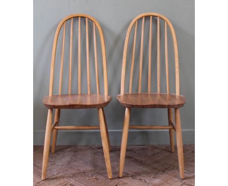 A pair of Ercol ash and elm hoop back chairs 