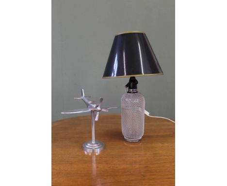 A chrome model aeroplane on stand and lamp made from a soda siphon (collector's item only)