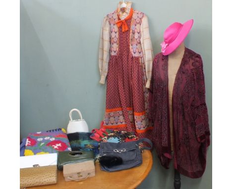 An assortments of vintage clothing including a 1970's dress, a jacket, handbags, hats, an embroidered blanket and a mohair wr