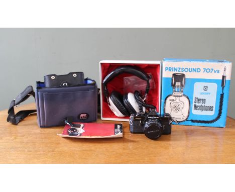 A pair of original Prinzsound 707VS stereo headphones and a Pentax camera with case