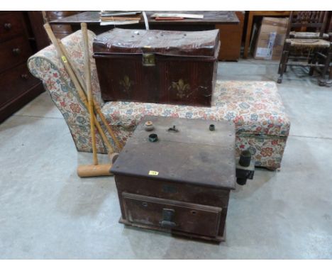 An ottoman day bed, an early 20th century chicken incubator, three croquet mallets and a battered tin trunk