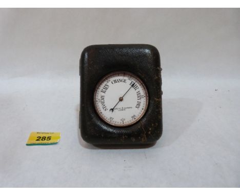 A leather cased travelling barometer by Negretti and Zambra. 5' high
