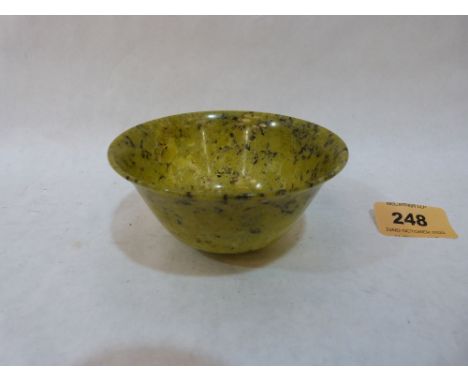 A Chinese spinach seaweed jade bowl. Republic period. 4' diam