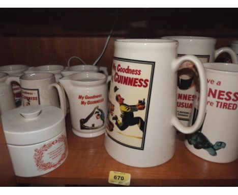 11 Guinness pub water jugs; a Guinness table lamp and a Carlton Ware cheese jar (A.F.)