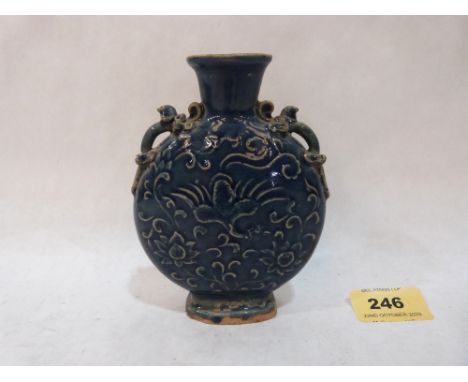 A Chinese blue glazed earthenware flask, the shoulders with two lugs, decorated with birds and foliage. 5' high