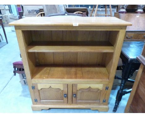 A joined light oak bookcase, made by Oakwood Furniture of Chester. 36' wide
