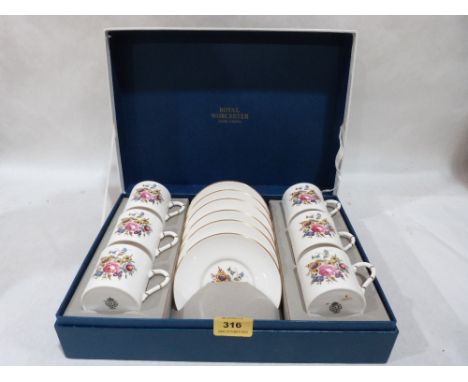 A boxed Royal Worcester set of six coffee cans and saucers