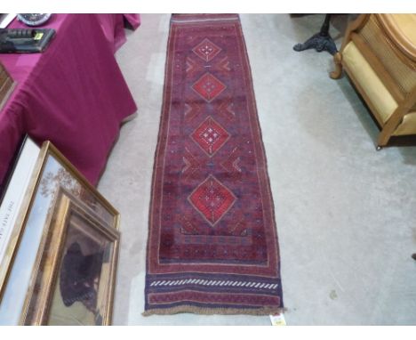 A Meshwani carpet runner. 2.4m x 0.6m
