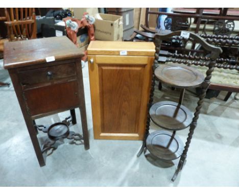 A light oak wall cabinet; a mahogany washstand and an oak three tier cake stand 
