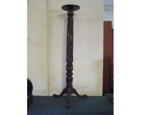 A Carved Mahogany Torchere Stand on Tripod Base 133 Cm High.  