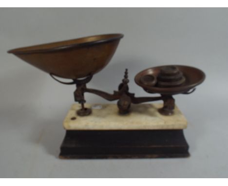 A Set of Kitchen Scales and Weights on Wooden and Marble Plinth.