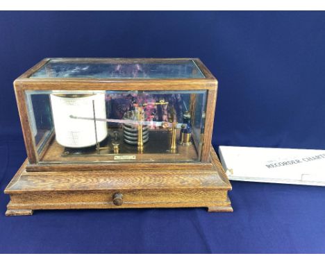 An oak and bevelled glass cased barograph, the base with plaque 'Benn Franks Optician Hull Hanley Etc', 36.5cm, together with