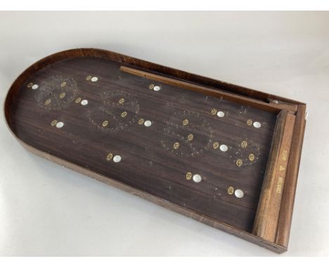 A bagatelle board, Corinthian Master model by Abbey, 72cm and a Remy Martin cognac barrel shaped games compendium, 27cm high